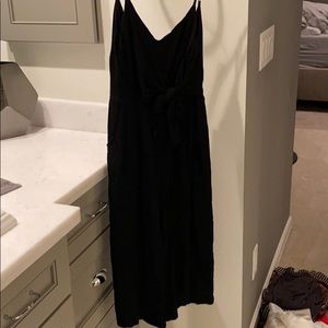Black romper midi length with bow tie in front